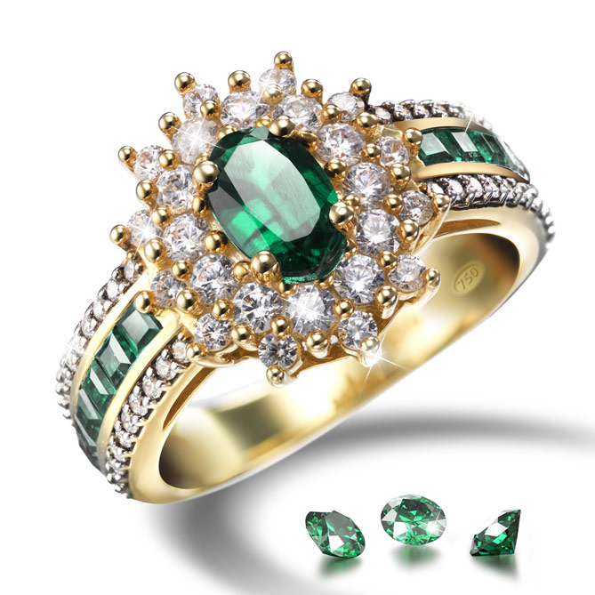 Anillo ETERNAL EMERALDS: Una impresionante Esmeralda, rodeada de Topacios y Diamantes sobre Oro de 1ª Ley